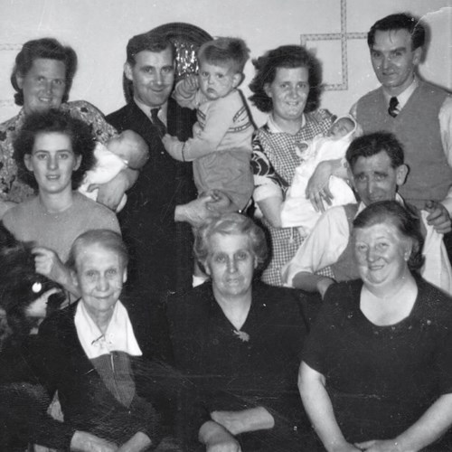 Family Gathering At Grandparent's Flat In Anniesland. Murdo'morrisons Father Is Holding Him