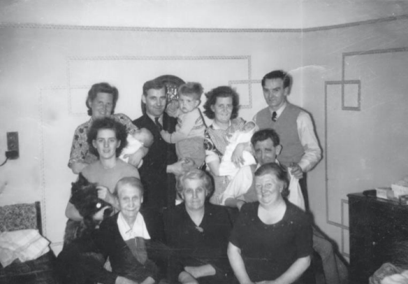 Family gathering at grandparent's flat in Anniesland.  Murdo Morrison’s father is holding him.